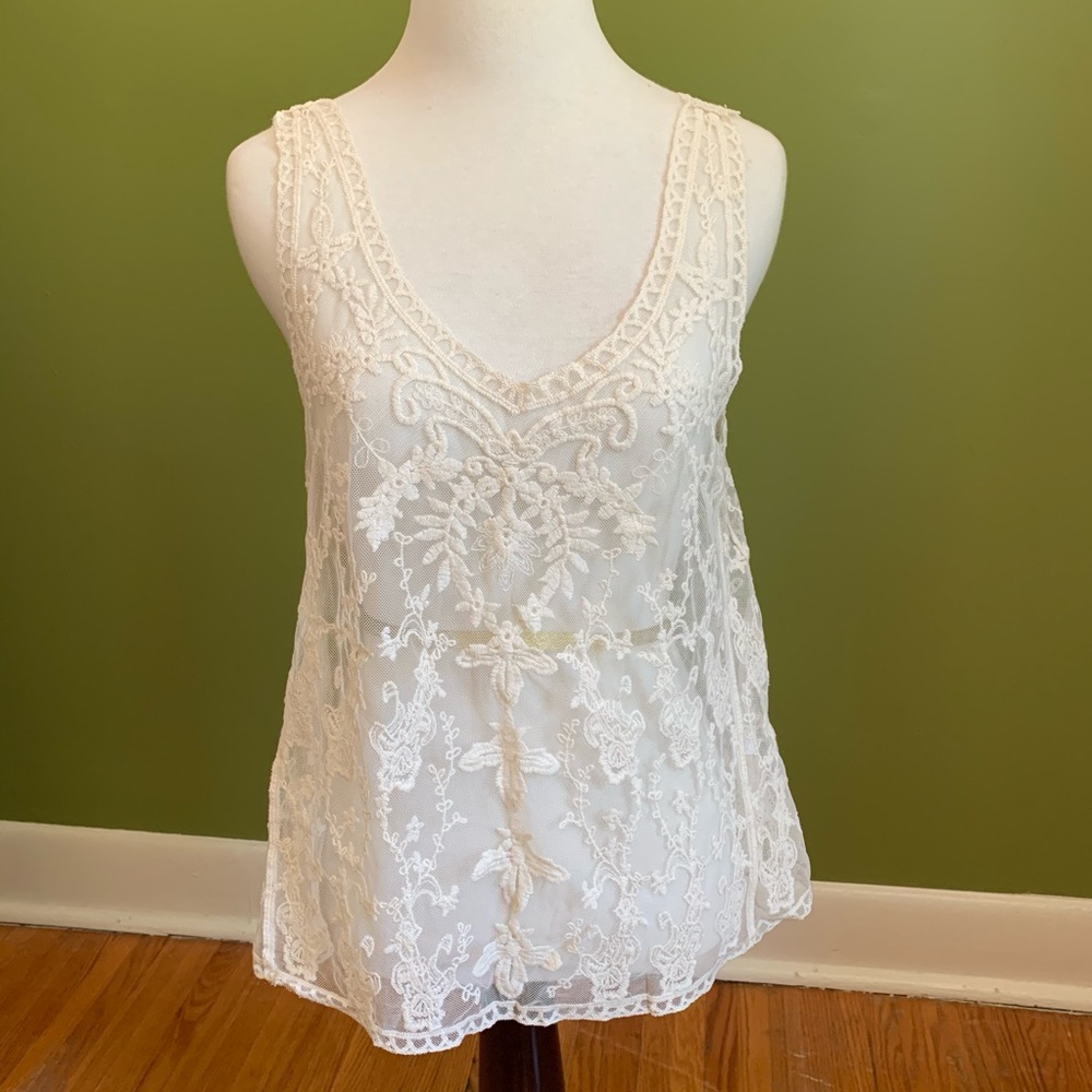 Cream coloured layering lace tank top.